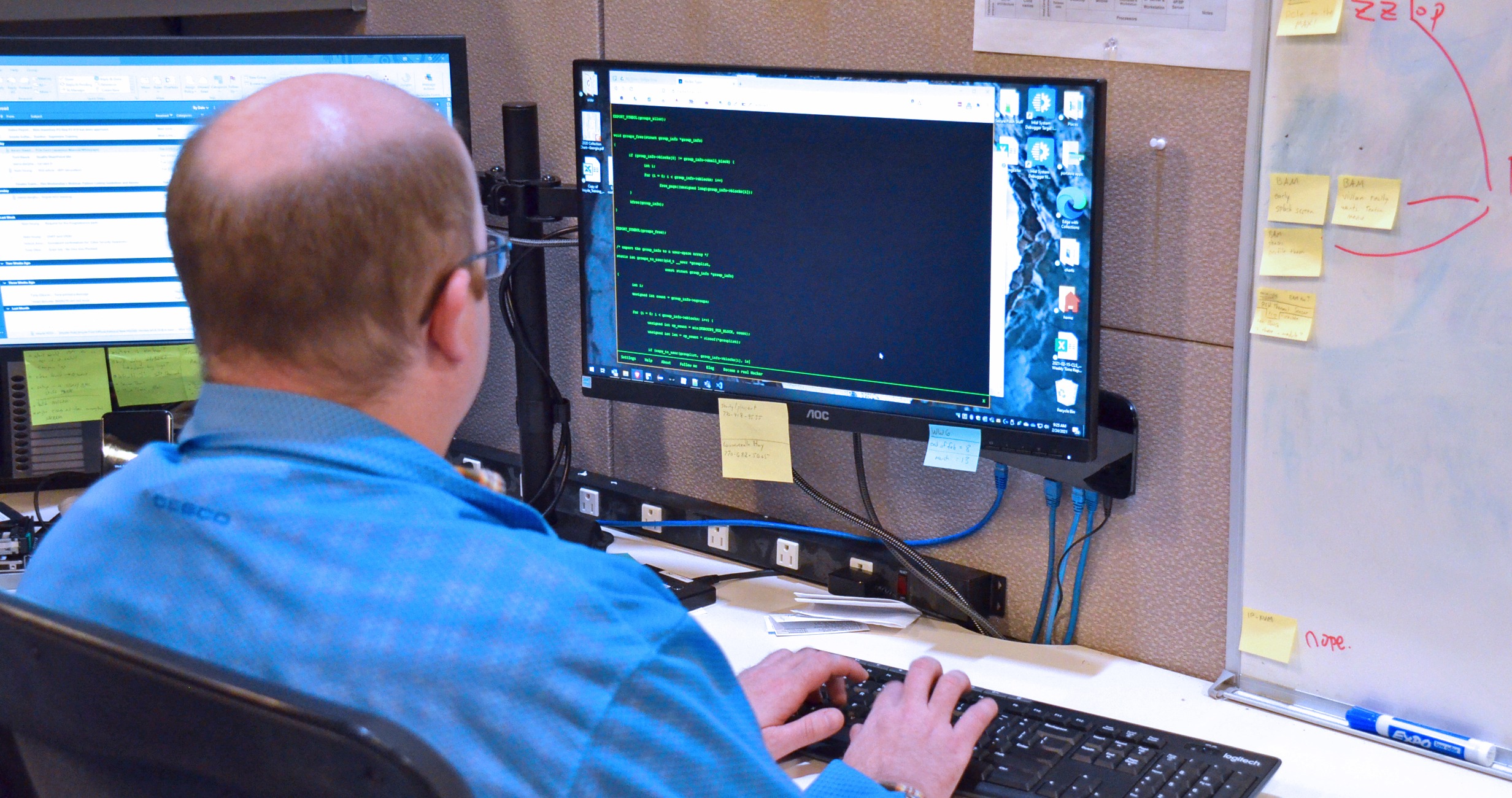 This is a photo of a Trenton Systems software engineer typing computer code.