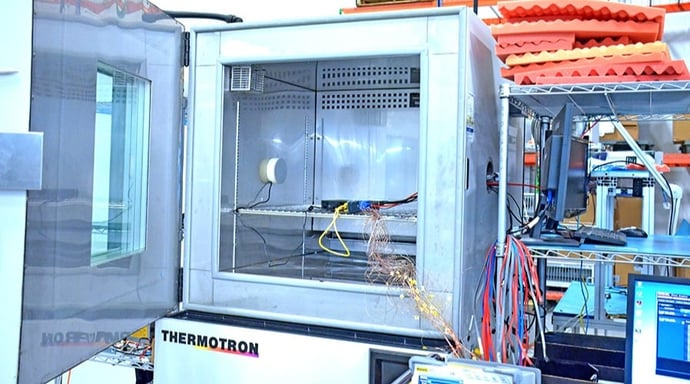 A rugged mini PC being tested inside a Thermotron environmental testing chamber