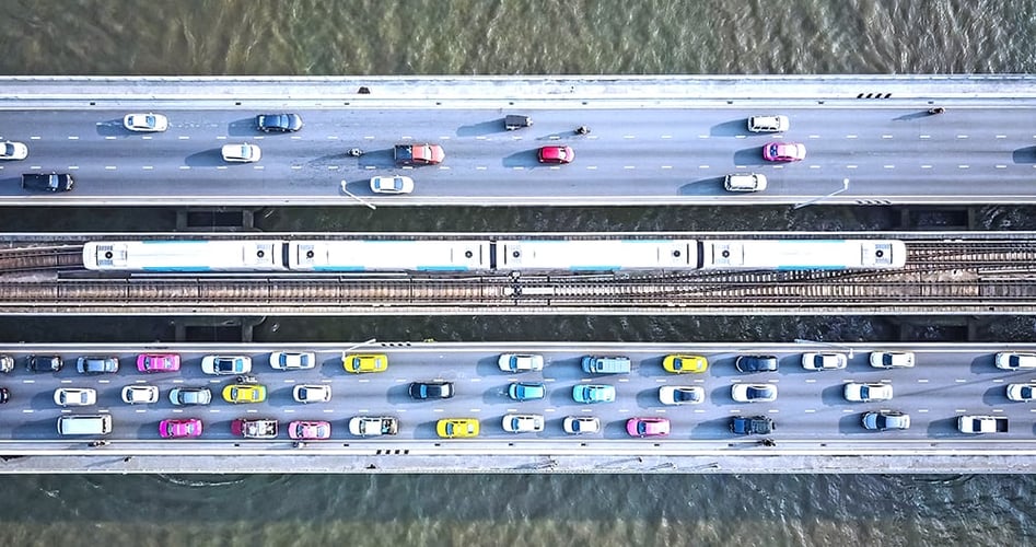 Aerial drone photograph of traffic in a metropolitan area, used to illustrate PCIe lanes.