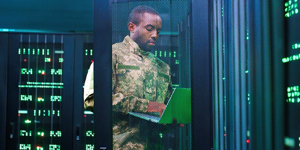 A man inspects a military server