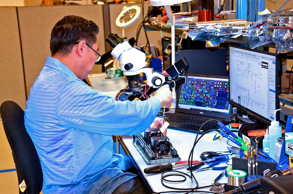 Trenton Systems employee assembling an SEP8253 processor board