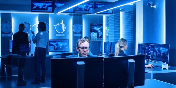 Professionals work in a command and control center
