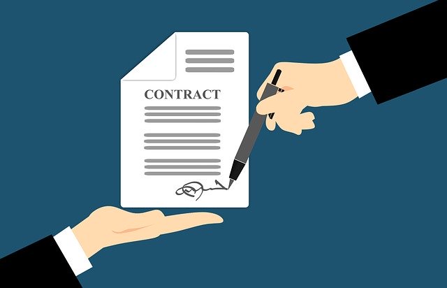 A person signs a contract