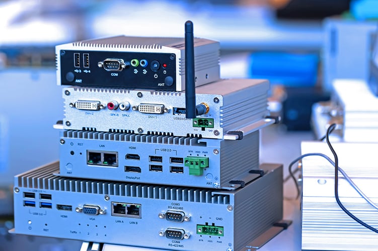 A set of four embedded computers stacked on top of each other