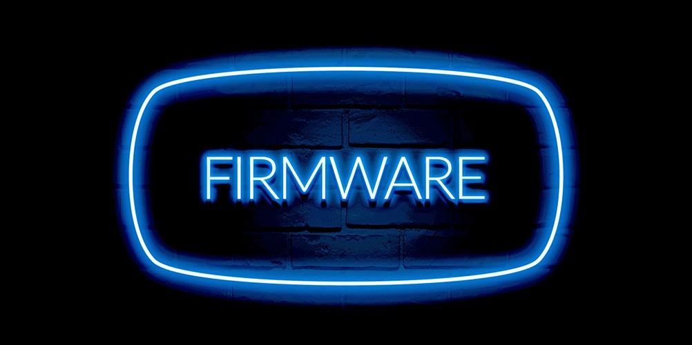 This is a photo of a neon sign that reads "firmware."