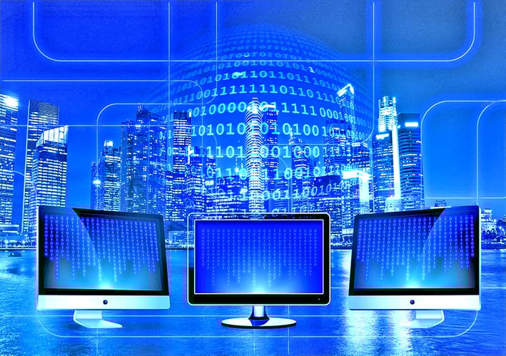 computer monitors showcasing binary code