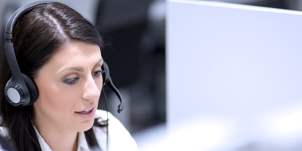 A technical support agent works on solving a customer's problem