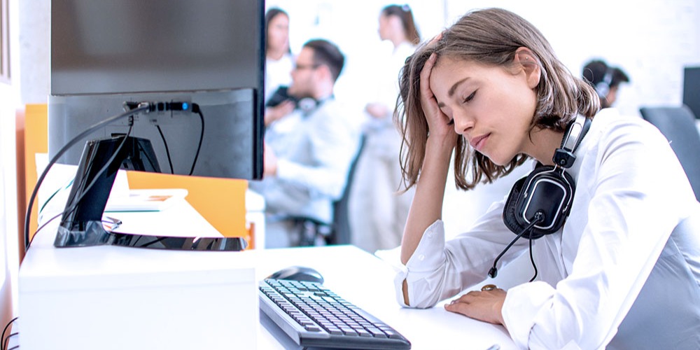 A technical support agent looks exhausted