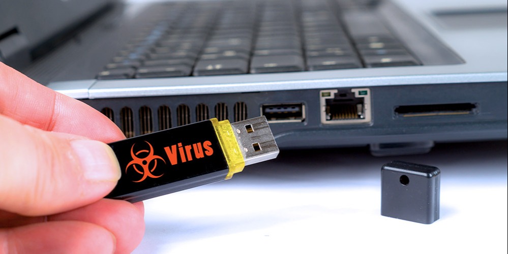 This is a photo of a USB flash drive with "virus" printed on it.