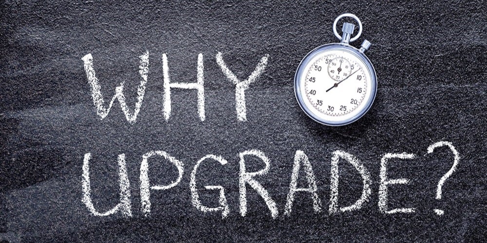 This is a black-and-white graphic with a stopwatch that reads, "Why upgrade?"
