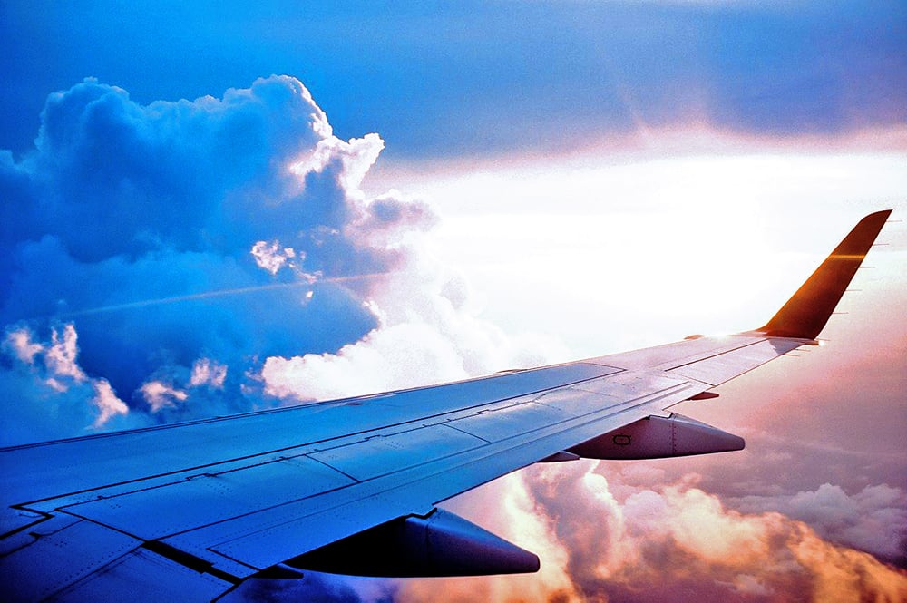 The wing of an aircraft mid-flight